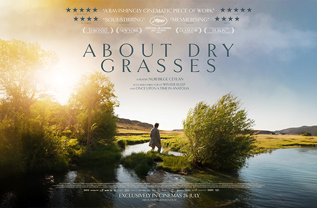 Poster for About Dry Grasses. A lone figure stands on a small grassy island in the middle of a river, with leafy trees, and a dawning sun creating a silhouette