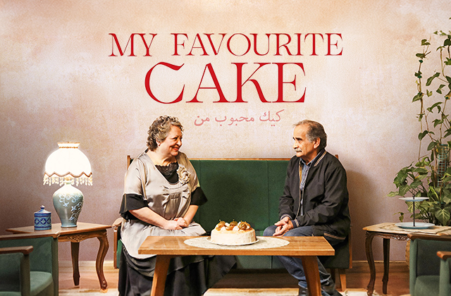 Poster for My Favourite Cake. An older Iranian woman and man sit at a coffee table, on a green couch, looking at each other fondly. There is a highly decorated cake on the table in front of them.