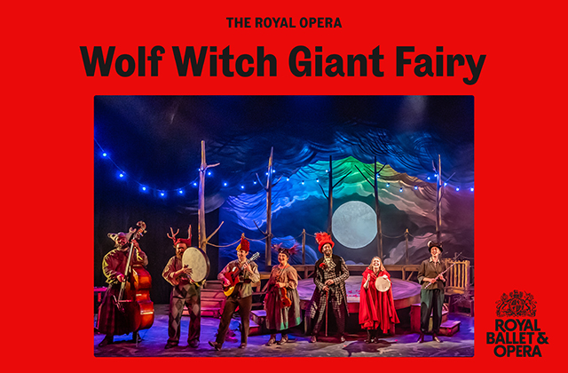 Still image of a live performance of Wolf Witch Giant Fairy, with a line of performers at the front of the stage, dressed as fairy tale characters, playing a selection of different instruments. Framed in solid red, with the show's title above