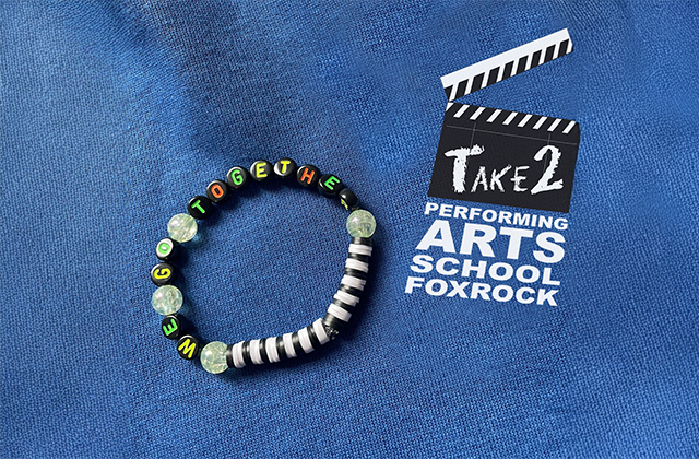 A beaded friendship bracelet with the words we go together spelled out lies on a blue background, with the Take2 performing arts school logo beside it