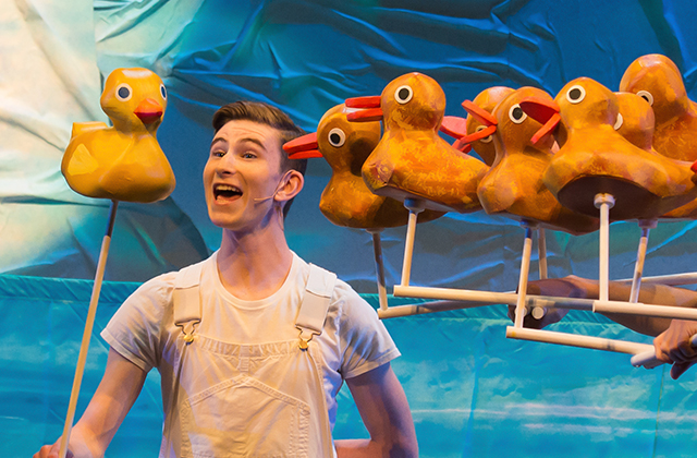 The puppet rubber ducks of 10 Little Rubber Ducks, and one puppet performer visibly puppeting one of them.